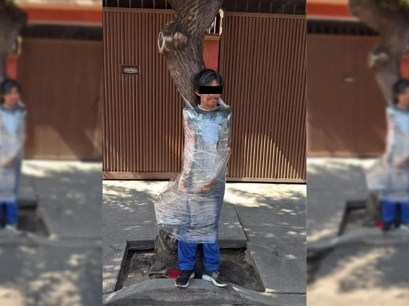 Un hombre señalado como presunto ladrón fue amarrado con playo a un árbol por vecinos en la alcaldía Benito Juárez, luego de que aparentemente fuera sorprendido robando. | Foto: Especial.